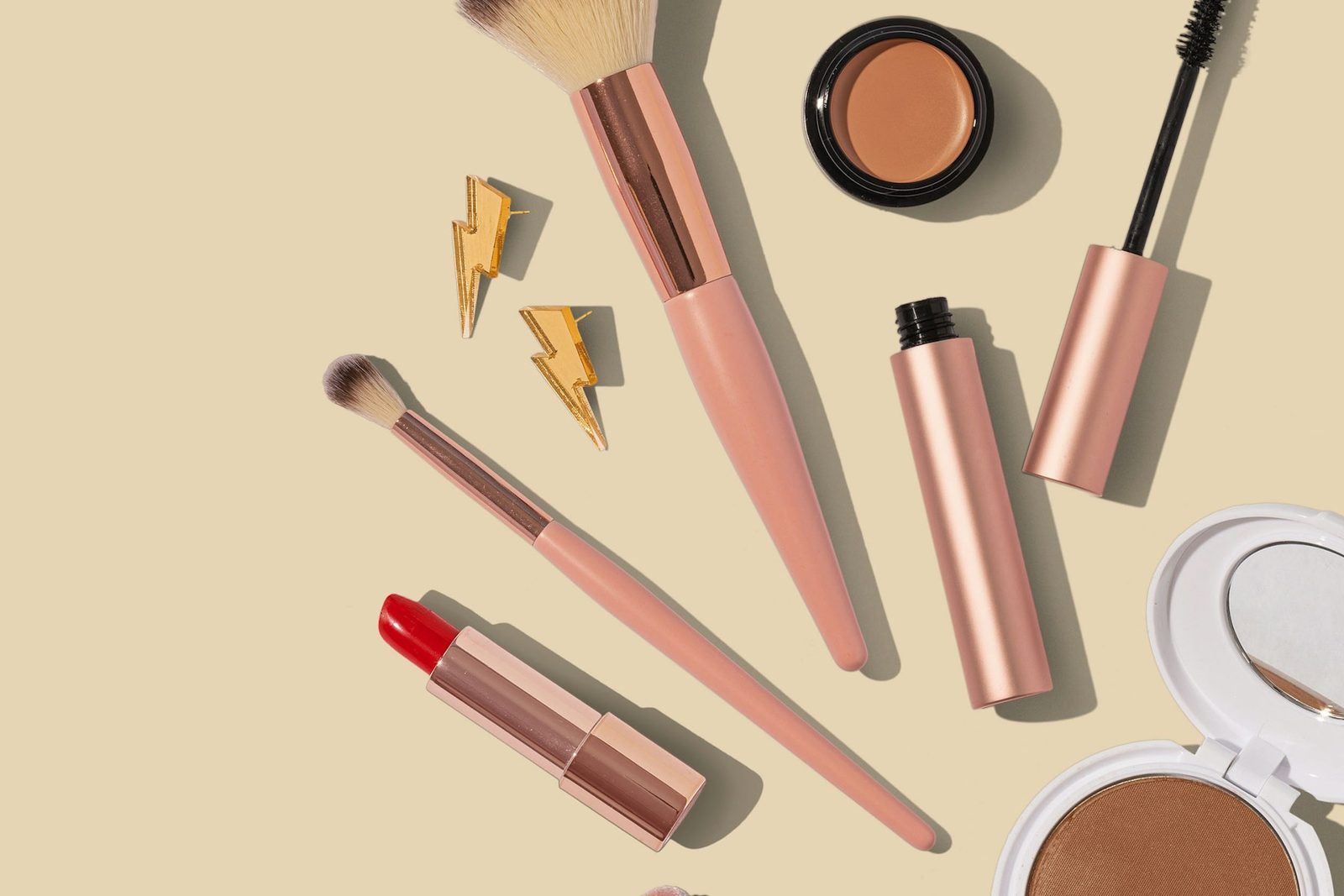 Beauty cosmetics arranged on a neutral surface