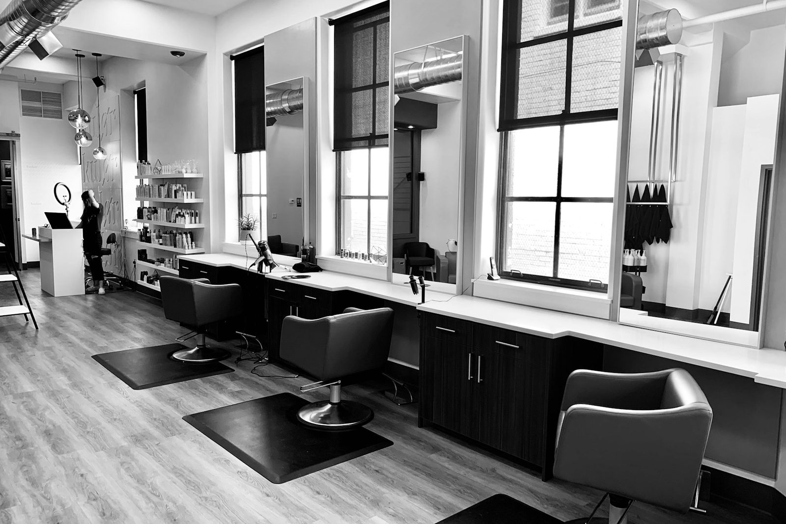 Warm hair salon interior with styling chairs
