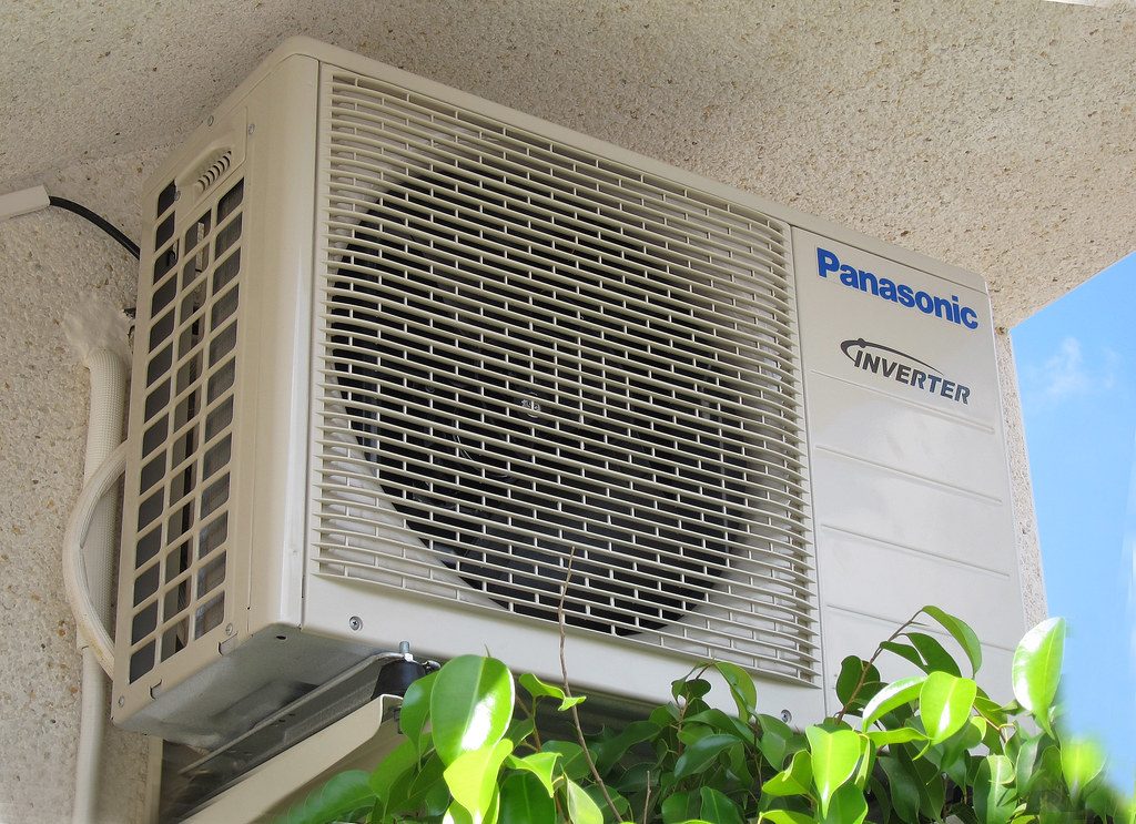 Outdoor air conditioning condenser unit mounted outside