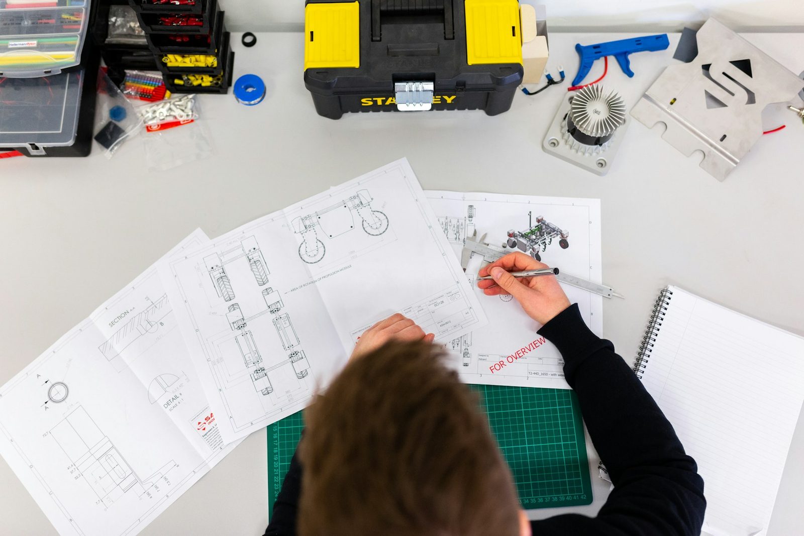 Technician workspace with tools and plans